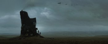Movie still from “Harry Potter and the Deathly Hallows: Part 1” (2010), directed by David Yates – A group of people standing on top of a dirt field; Extreme Wide shot, Low angle