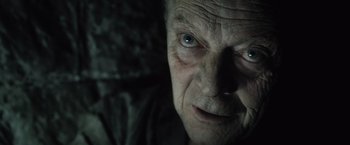 Movie still from “Harry Potter and the Deathly Hallows: Part 1” (2010), directed by David Yates – An old man with a very intense look on his face; Close Up shot, High angle