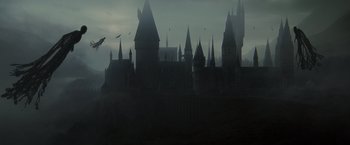Movie still from “Harry Potter and the Deathly Hallows: Part 2” (2011), directed by David Yates – A castle with a bunch of spires in the background; Extreme Wide shot, High angle