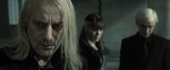 Movie still from “Harry Potter and the Deathly Hallows: Part 2” (2011), directed by David Yates – A man and a woman standing next to each other; Close Up shot, Over the shoulder angle