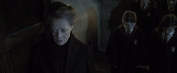 Movie still from “Harry Potter and the Deathly Hallows: Part 2” (2011), directed by David Yates – A woman in a black jacket and a man in a black jacket; Close Up shot, Over the shoulder angle