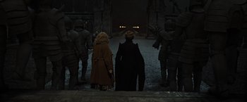 Movie still from “Harry Potter and the Deathly Hallows: Part 2” (2011), directed by David Yates – A couple of people standing next to each other on a street; Wide shot, High angle