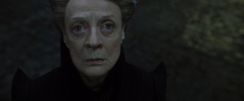 Movie still from “Harry Potter and the Deathly Hallows: Part 2” (2011), directed by David Yates – An older woman with a sad look on her face; Close Up shot, Low angle
