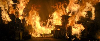 Movie still from “Harry Potter and the Deathly Hallows: Part 2” (2011), directed by David Yates – A large fire is burning in a building; Extreme Wide shot, High angle