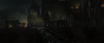 Movie still from “Harry Potter and the Deathly Hallows: Part 2” (2011), directed by David Yates – An old castle is lit up at night time; Extreme Wide shot, High angle