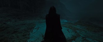 Movie still from “Harry Potter and the Deathly Hallows: Part 2” (2011), directed by David Yates – A person sitting on the ground in the dark; Wide shot, High angle