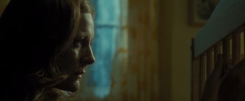 Movie still from “Harry Potter and the Deathly Hallows: Part 2” (2011), directed by David Yates – A person looking out of a window; Close Up shot, Over the shoulder angle