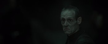 Movie still from “Harry Potter and the Deathly Hallows: Part 2” (2011), directed by David Yates – An old man with a strange look on his face; Close Up shot, Low angle