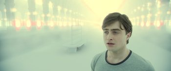 Movie still from “Harry Potter and the Deathly Hallows: Part 2” (2011), directed by David Yates – A young man standing in front of a bench in the fog; Medium shot, High angle