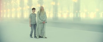 Movie still from “Harry Potter and the Deathly Hallows: Part 2” (2011), directed by David Yates – A man and a young boy standing next to each other; Wide shot, Low angle