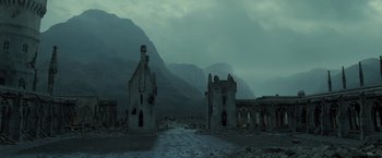 Movie still from “Harry Potter and the Deathly Hallows: Part 2” (2011), directed by David Yates – An old castle in the middle of a deserted area; Extreme Wide shot, Low angle