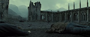 Movie still from “Harry Potter and the Deathly Hallows: Part 2” (2011), directed by David Yates – An old abandoned building in the middle of a field; Wide shot, Low angle