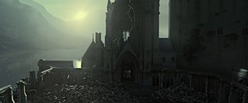 Movie still from “Harry Potter and the Deathly Hallows: Part 2” (2011), directed by David Yates – A very large building with a very large amount of debris; Extreme Wide shot, High angle