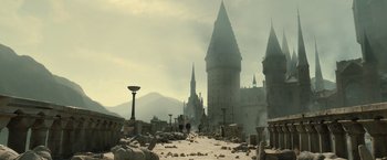 Movie still from “Harry Potter and the Deathly Hallows: Part 2” (2011), directed by David Yates – A large castle with a lot of rocks around it; Extreme Wide shot, High angle