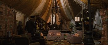 Movie still from “Harry Potter and the Goblet of Fire” (2005), directed by Mike Newell – A living room filled with furniture next to a window; Wide shot, High angle