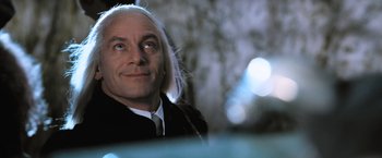 Movie still from “Harry Potter and the Goblet of Fire” (2005), directed by Mike Newell – A person wearing a suit and tie; Close Up shot, Low angle