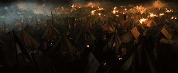 Movie still from “Harry Potter and the Goblet of Fire” (2005), directed by Mike Newell – Many tents are set on fire in a field; Extreme Wide shot, High angle