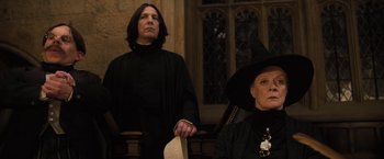 Movie still from “Harry Potter and the Goblet of Fire” (2005), directed by Mike Newell – A man and a woman dressed as harry and snape; Medium shot, Low angle
