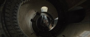 Movie still from “Harry Potter and the Goblet of Fire” (2005), directed by Mike Newell – Looking down at a spiral staircase in a building; Extreme Wide shot, Overhead angle