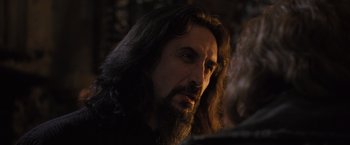 Movie still from “Harry Potter and the Goblet of Fire” (2005), directed by Mike Newell – A man with long hair and a long beard; Close Up shot, Over the shoulder angle