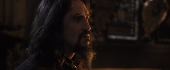 Movie still from “Harry Potter and the Goblet of Fire” (2005), directed by Mike Newell – A man with long hair and a long beard; Close Up shot, Over the shoulder angle