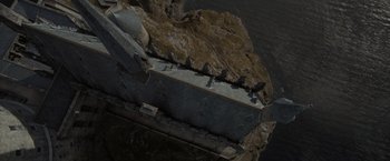 Movie still from “Harry Potter and the Goblet of Fire” (2005), directed by Mike Newell – An aerial view of a rock formation and a body of water; Extreme Wide shot, Overhead angle