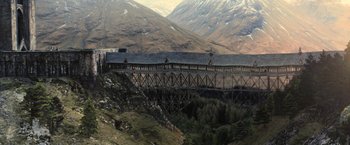 Movie still from “Harry Potter and the Goblet of Fire” (2005), directed by Mike Newell – A train on a bridge in the mountains; Extreme Wide shot, High angle
