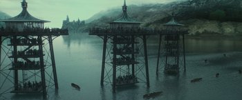 Movie still from “Harry Potter and the Goblet of Fire” (2005), directed by Mike Newell – A group of people standing on top of a wooden structure; Extreme Wide shot, High angle