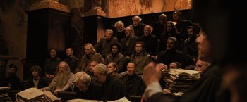 Movie still from “Harry Potter and the Goblet of Fire” (2005), directed by Mike Newell – A group of people sitting in a room; Wide shot, High angle