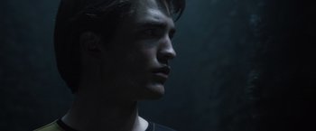 Movie still from “Harry Potter and the Goblet of Fire” (2005), directed by Mike Newell – A young man is looking into the distance; Close Up shot, Low angle