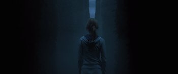 Movie still from “Harry Potter and the Goblet of Fire” (2005), directed by Mike Newell – A woman standing in the dark looking into the distance; Medium shot, Low angle