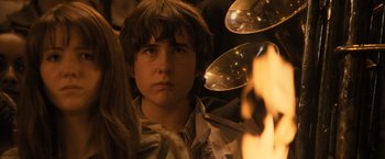 Movie still from “Harry Potter and the Goblet of Fire” (2005), directed by Mike Newell – A young man is looking into the distance; Close Up shot, Over the shoulder angle