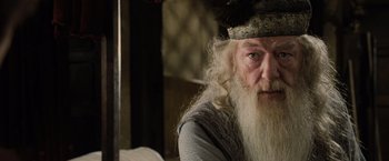 Movie still from “Harry Potter and the Goblet of Fire” (2005), directed by Mike Newell – An old man with a long white beard wearing a crown; Close Up shot, Low angle