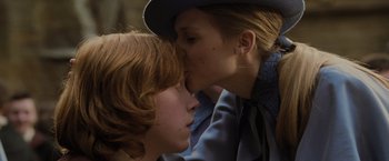 Movie still from “Harry Potter and the Goblet of Fire” (2005), directed by Mike Newell – Two people are kissing each other on the cheek; Close Up shot, Over the shoulder angle