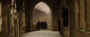 Movie still from “Harry Potter and the Goblet of Fire” (2005), directed by Mike Newell – A group of people standing inside of an archway; Extreme Wide shot, High angle