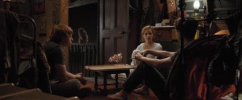 Movie still from “Harry Potter and the Half-Blood Prince” (2009), directed by David Yates – A group of people sitting around a living room; Wide shot, High angle