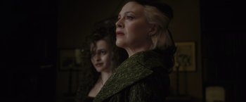 Movie still from “Harry Potter and the Half-Blood Prince” (2009), directed by David Yates – Two women standing next to each other in front of a mirror; Close Up shot, Low angle