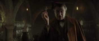 Movie still from “Harry Potter and the Half-Blood Prince” (2009), directed by David Yates – An older man holding a key in his hand; Close Up shot, Low angle