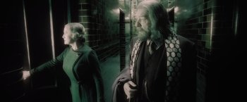 Movie still from “Harry Potter and the Half-Blood Prince” (2009), directed by David Yates – A man and a woman standing next to each other; Medium shot, Over the shoulder angle