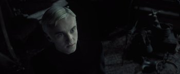 Movie still from “Harry Potter and the Half-Blood Prince” (2009), directed by David Yates – A man with blonde hair and blue eyes; Close Up shot, Over the shoulder angle