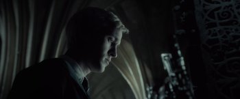 Movie still from “Harry Potter and the Half-Blood Prince” (2009), directed by David Yates – A young man is looking into the distance; Close Up shot, Low angle