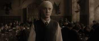 Movie still from “Harry Potter and the Half-Blood Prince” (2009), directed by David Yates – A man with blonde hair wearing a tie; Close Up shot, Low angle