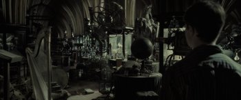 Movie still from “Harry Potter and the Half-Blood Prince” (2009), directed by David Yates – A room filled with lots and lots of stuff on the floor; Wide shot, High angle