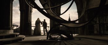 Movie still from “Harry Potter and the Half-Blood Prince” (2009), directed by David Yates – A man and a woman standing next to each other on a balcony; Wide shot, Low angle