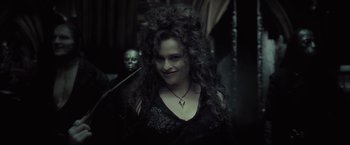 Movie still from “Harry Potter and the Half-Blood Prince” (2009), directed by David Yates – A person with long curly hair; Close Up shot, Over the shoulder angle