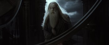 Movie still from “Harry Potter and the Half-Blood Prince” (2009), directed by David Yates – A man with long white hair and a long white beard; Medium shot, Low angle