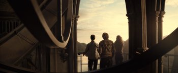 Movie still from “Harry Potter and the Half-Blood Prince” (2009), directed by David Yates – A group of people standing next to each other on top of a boat; Wide shot, Low angle