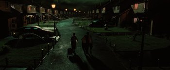 Movie still from “Harry Potter and the Order of the Phoenix” (2007), directed by David Yates – Two people walking down a street at night; Extreme Wide shot, High angle