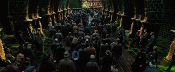 Movie still from “Harry Potter and the Order of the Phoenix” (2007), directed by David Yates – A group of people standing in the middle of a tunnel; Extreme Wide shot, High angle