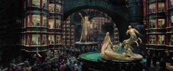 Movie still from “Harry Potter and the Order of the Phoenix” (2007), directed by David Yates – A crowd of people standing in a room with a statue; Extreme Wide shot, High angle